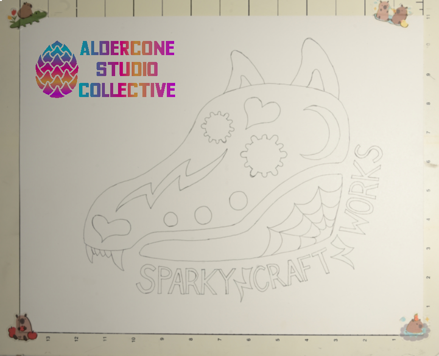 A photograph of the Sparky Craft Works logo with initial line work done: It is a cartoony dog skull with flower eyes, a lightning bolt down its snoot, and a heart heart and moon drawn on the top of the skull. The lower jaw has a spider web on it. Wrapping the lower part of the skull is the name with lightning bolts between the words